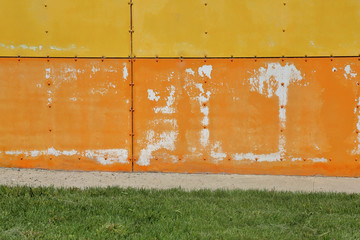 Textured surface of a bright building wall