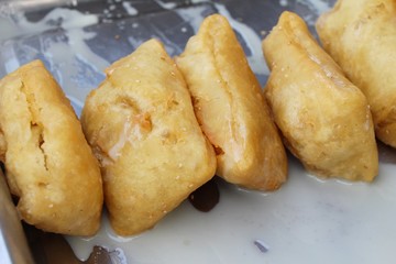 Deep fried dough put sweet condensed milk
