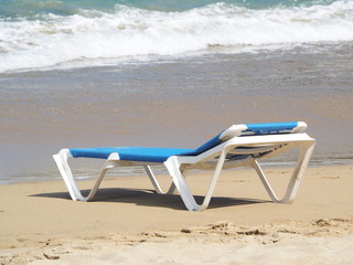 Fototapeta na wymiar chaise lounge on the sandy beach of the Atlantic Ocean.