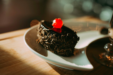 Mouth watering cream chocolate chip cake - cherry on top