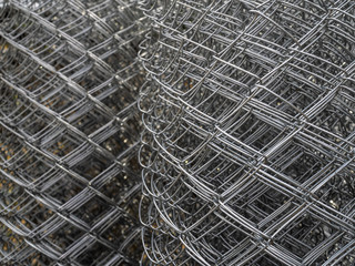 Sale of fencing, rolled into rolls. Galvanized steel grating in stock. Fence with large cells