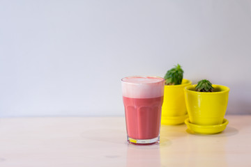 Pink, strawberry, sweet cappuccino on the white background with sticky notes on the wall.