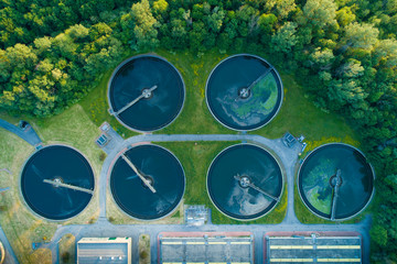 Aerial view of a city's waste management sewage and water treatment plants. Waste water purification.