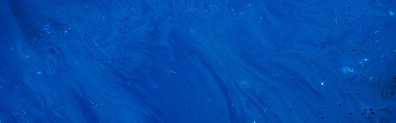 Abstract dark blue color gradient background. Acrylic paints monochrome texture pattern. Liquid...
