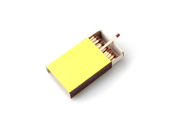 Matches made of natural wood yellow box, on a white background.