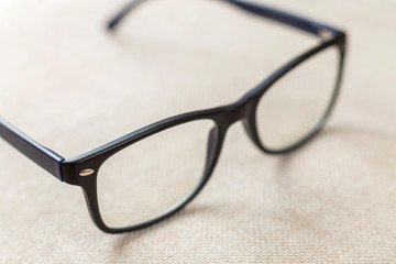 Reading spectacles, fashionable eyeglasses isolated on blurred white copy space background.