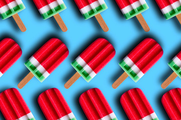 Flat lay of colorful ice cream on the modern rustic on blue background at home office desk wallpaper, top view colorful ice cream pattern on blue pastel background. Minimal summer concept.