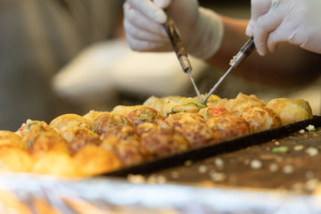 Takoyaki is a most famous Japanese snack food in Japan.