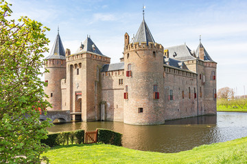 Views of the 700 year old castle 'Muiderslot' with castle-moat, Netherlands