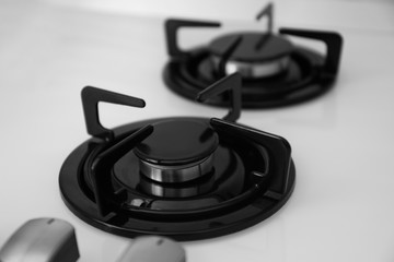 Modern built-in gas cooktop, closeup. Kitchen appliance