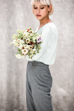 woman holding a boquet