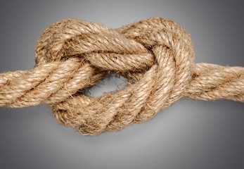 Knot on a cord close up on  background