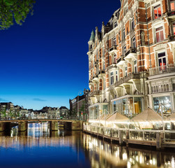 Fototapeta na wymiar Amsterdam, Holland - May 13, 2019: Night view of the Amsterdam canals