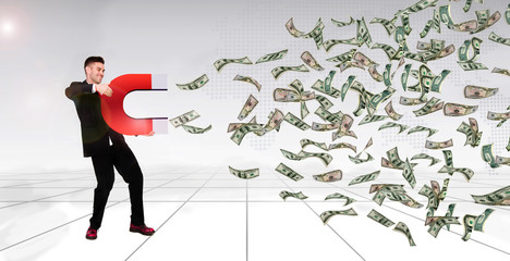 successful man holding horse shoe magnet attract money banknote, business finance wealth concept