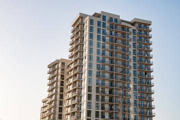 Fototapeta premium new multi-family houses against the blue sky