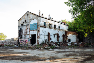 Destroyed building in summer, war