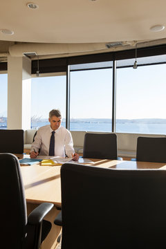 Male executive in conference room.