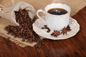 anise flowers on a cup with hot coffee
