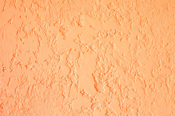 Orange textured plastered wall. Fresh otvetka in commercial premises, designer renovation in the...
