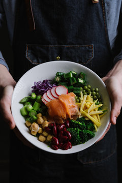 Man holding salad bowl