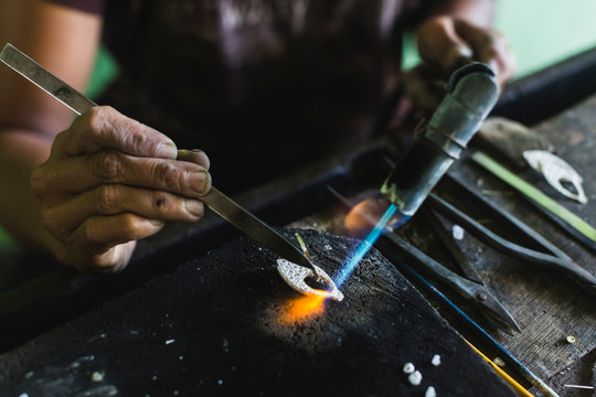 Woman making Silver jewelry