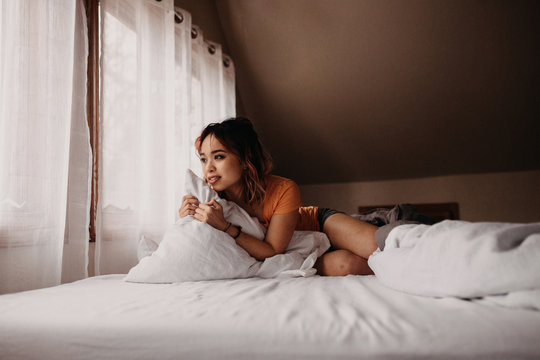 Beautiful Woman in Comfy Bed