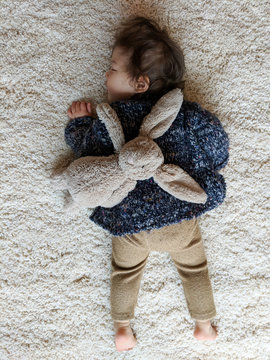 Baby resting with bunny