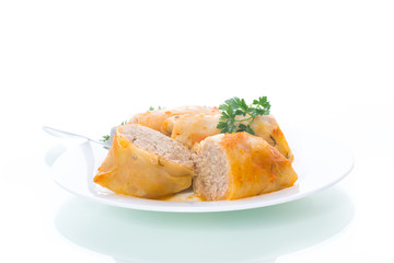 Stuffed cabbage leaves with minced meat and rice in tomato sauce.