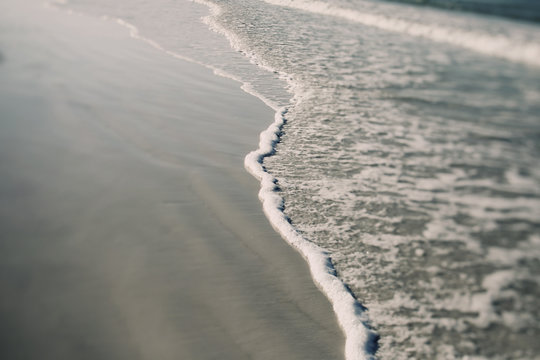 Gentle Waves On A White Sand Beach