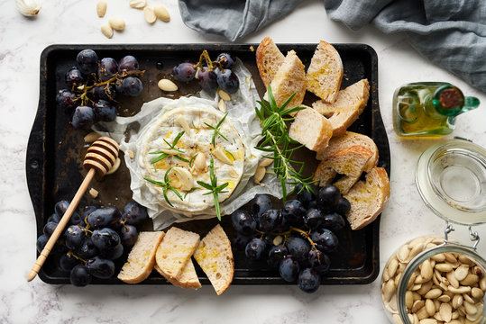 Cheese,grapes and sourdough bread.
