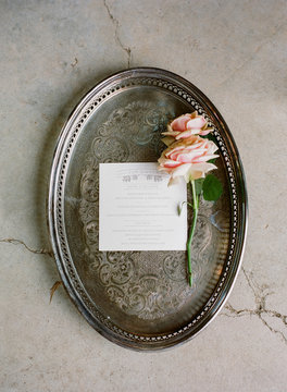 Menu from wedding placed on antique tray