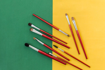 Red brushes for blush, eyeshadow and other work of a makeup artist