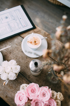 Coffe and flowers on the table
