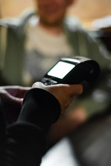 Cropped view of womens hand using credit card to make payment on Payment terminal in bar