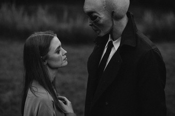 Alien and weeping woman