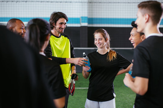 Soccer players taking a break.