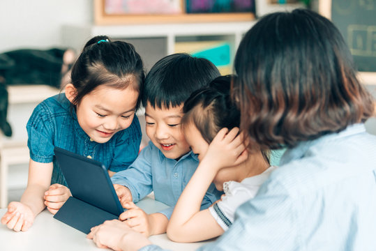 Students learning with digital tablets