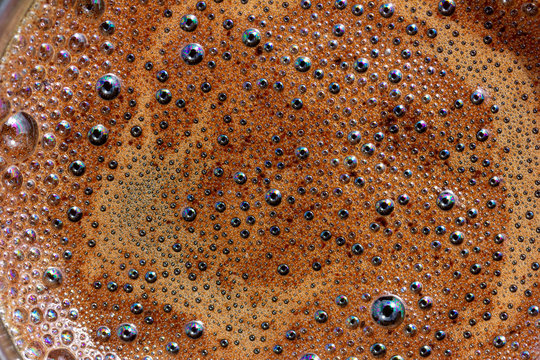macro photo foam on coffee closeup top view