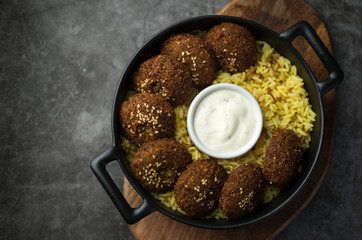 Vegan falafel with rice and sauce
