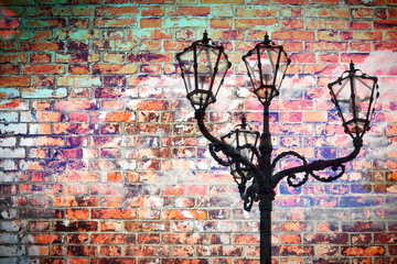 Classic portuguese streetlight - concept image against a a brick wall - image with copy space