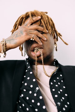 Black man in golden accessories