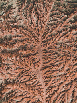 Aerial picture of a desert with eroded mountains
