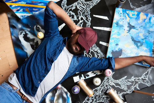 State of mind of an artist at his studio surrounded by his own a