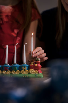 Hanukkah: Girl Holding Shamash Candle
