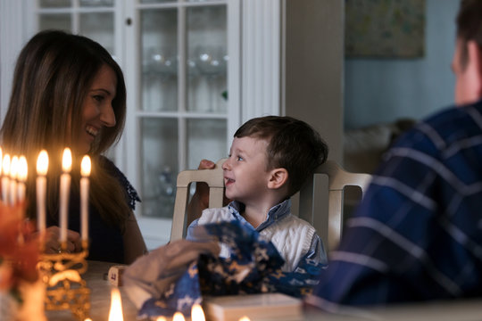 Hanukkah: Boy Excited To Be Opening Presents