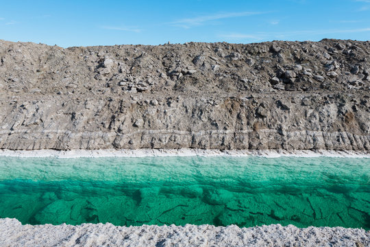 Calcium chloride mine tailings and canal in desert
