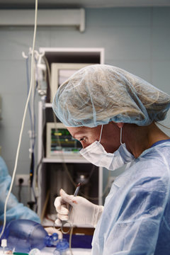 Concentrated surgeon working in hospital