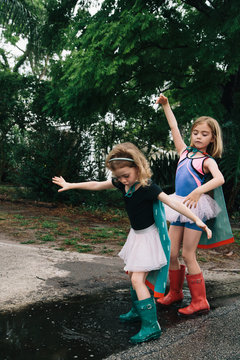 Dancing Supergirls In A Puddle