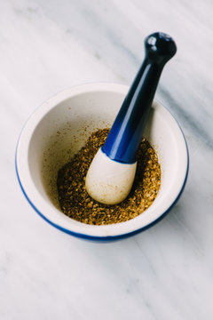 Za'atar spice grind in a mortar and pestle