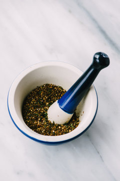 Za'atar spice grind in a mortar and pestle